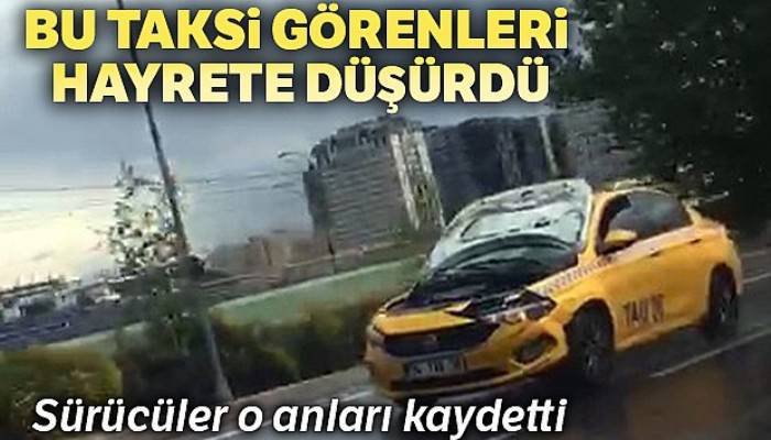 TEM Otoyolu'nda kaputu açık halde seyreden taksi hayrete düşürdü