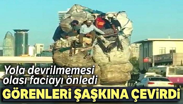 E-5'te kamyon kasasındaki çuval yığınlarının üzerinde tehlikeli yolculuk kamerada