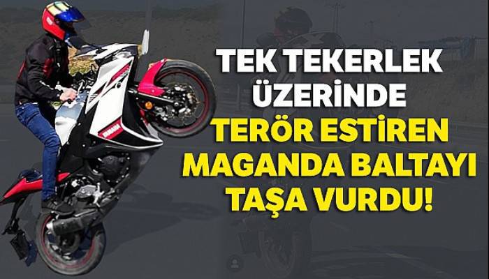 Tek tekerlek üzerinde terör estiren maganda baltayı taşa vurdu